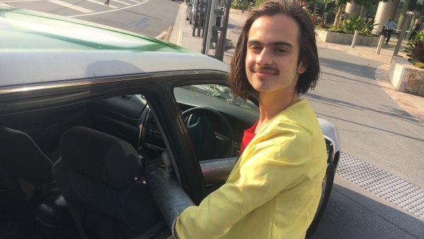 Brisbane protester Eric Herbert before he was cut from a car to which he had locked himself.