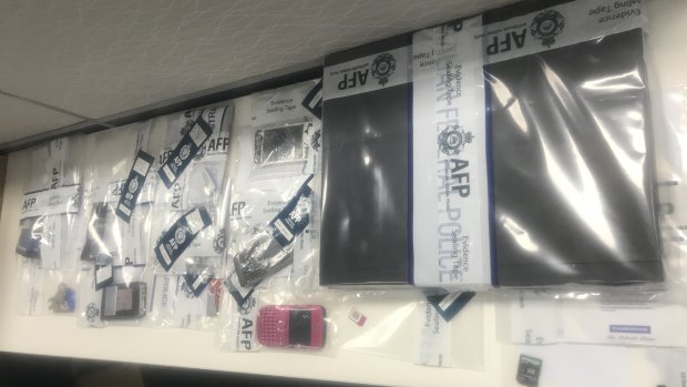 Some of the items seized during the AFP raids in Brisbane and the Gold Coast this week.
