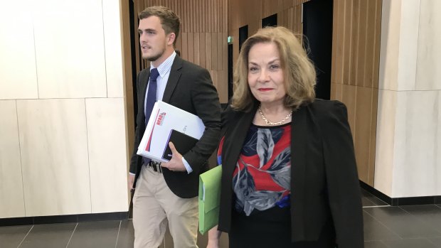 Prince Charles Hospital nurse Marg Gilbert leaves the Industrial Commission with Jack McGuire of the Queensland Nurses' Professional Association.