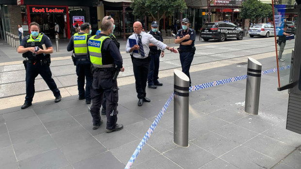 Police inspect broken glass and a damaged bollard in Bourke Street Mall after last week’s incident. 