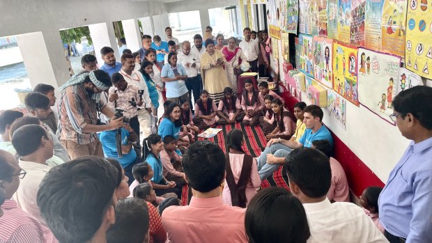 Pat Cummins draws a crowd at a school in Lucknow.