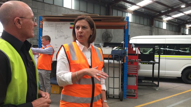 LNP leader Deb Frecklington has spent most of the campaign in various sheds wearing high-vis. 
