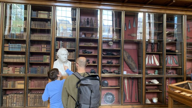 A boy examines a bust of Joseph Banks at the British Museum.