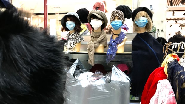 A shop sells masks at a deserted Stocklands Mall in Wetherill Park on Saturday.
