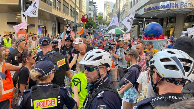 Police monitor the Extinction Rebellion protest in the Brisbane inner city last week.