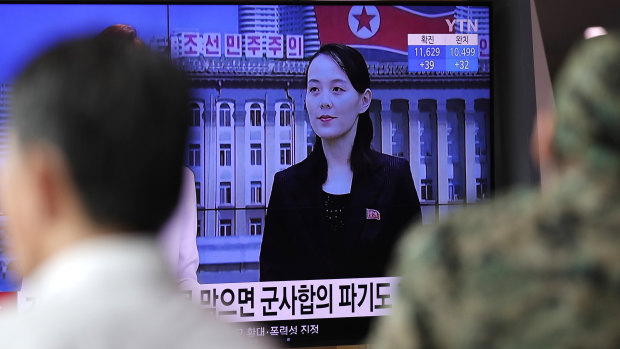 A man watches a TV news program with a file image of Kim Yo-Jong, the powerful sister of North Korea's leader Kim Jong-un, at the Seoul Railway Station in Seoul.