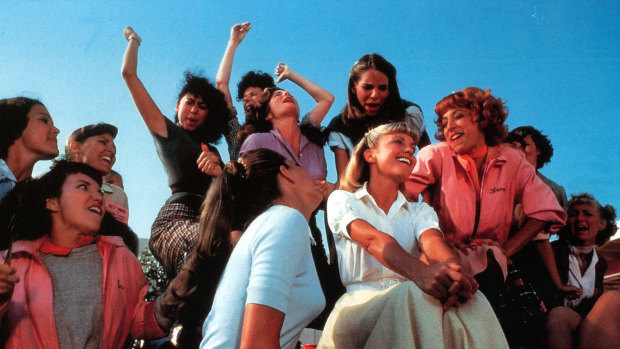 Olivia Newton-John (centre) with Didi Conn (right, in pink) singing Summer Lovin’ in Grease.