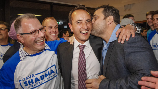 Liberal's Dave Sharma celebrates with guests at Easts Rugby Club in Rose Bay.