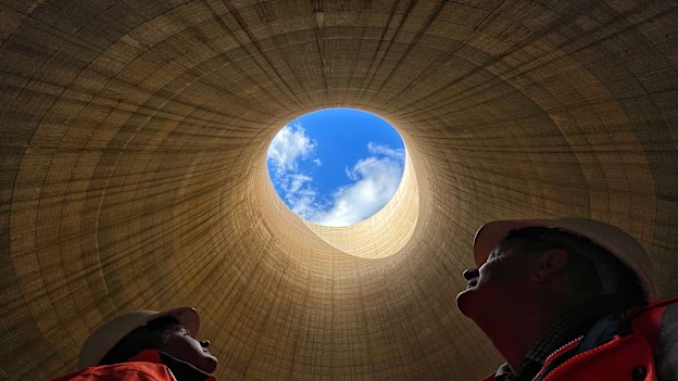 The ultimate echo chamber: Greenspot chief executive Brett Hawkins (left) and part owner Neil Schembri look skyward from inside the cooling tower of the shuttered Wallerawang Power Station. 