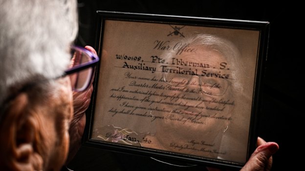Sonja Cowan with a certificate of merit from the British Army that she earned during World War II.