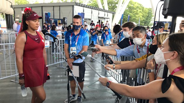 Osaka speaks with journalists after defeating China’s Zheng Saisai at the Olympics in Tokyo.
