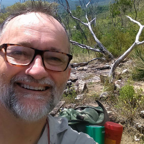 The quick actions of emergency department doctor John Hadok helped save the life of a Tasmanian tourist bitten by a shark in the Whitsunday Islands.