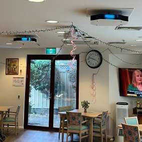 The ultraviolet light devices affixed to the roof in an aged care facility.