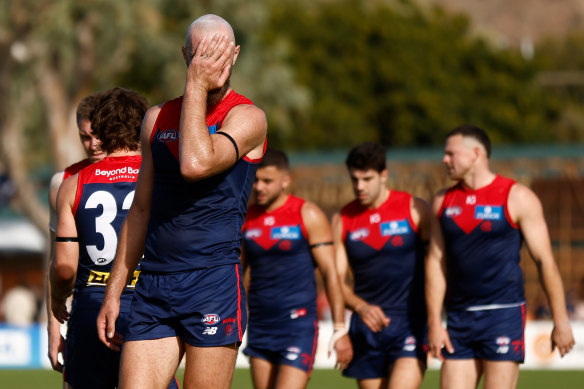 Skipper Max Gawn leads his beleaguered team off the field after their lamentable performance against Fremantle in Alice Springs.