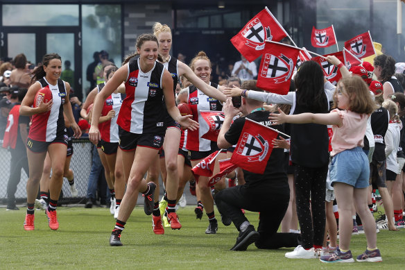 The Saints run out for their first AFLW game in front of a full house at Moorabbin.