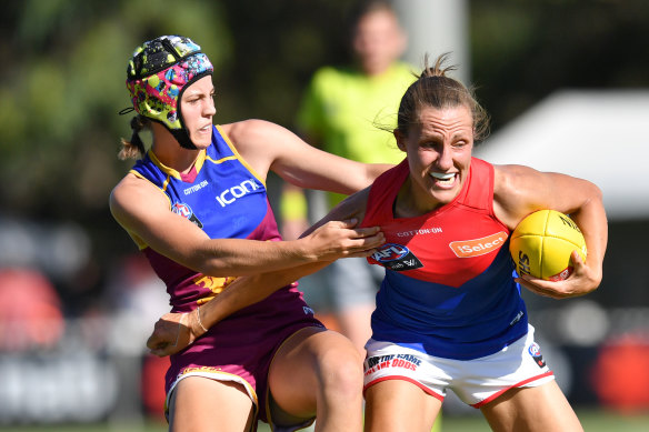 Karen Paxman, right, is tackled during round three of the 2019 season. 