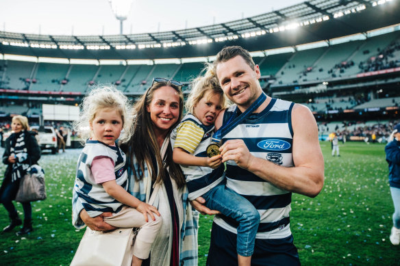Mardi and Patrick Dangerfield with their children after the 2022 premiership.