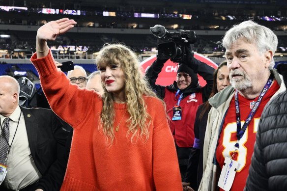 Taylor Swift walks with Ed Kelce after watching the Kansas City Chiefs defeat the Baltimore Ravens in January.