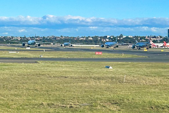 Planes waiting for gates at Sydney Airport.