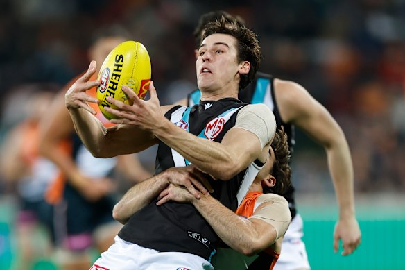 Toby Bedford lays a crunching tackle on Power skipper Connor Rozee.
