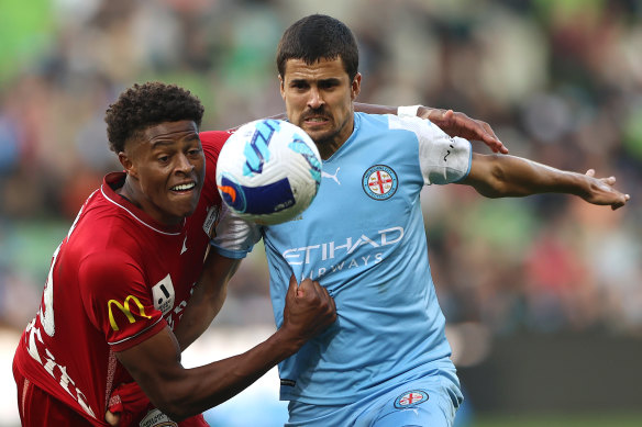 City’s Nuno Reis is challenged by Kusini Yengi.