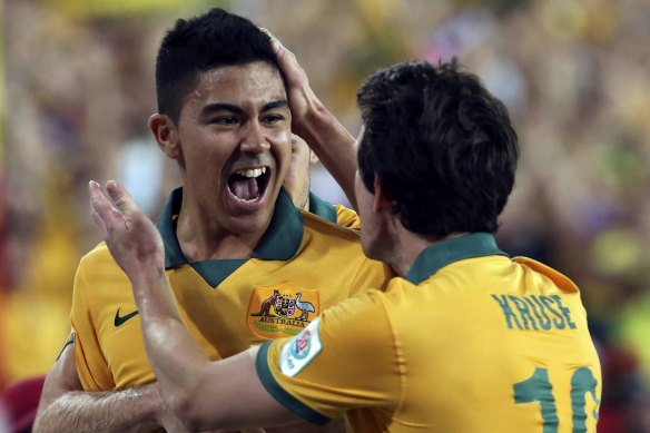 Massimo Luongo celebrates with Robbie Kruse after scoring in the Asian Cup final against South Korea at Stadium Australia in 2015.