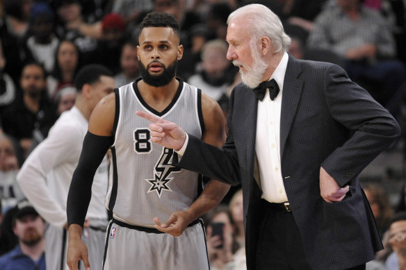 Mills with his mentor and San Antonio Spurs coach Gregg Popovich.