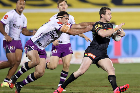 Dylan Edwards of the Panthers is tackled by Dale Finucane.