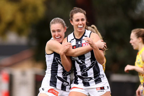 Chloe Molloy celebrates a goal for the Pies.