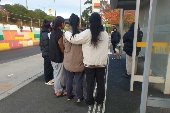 Family members at the scene on Friday morning.