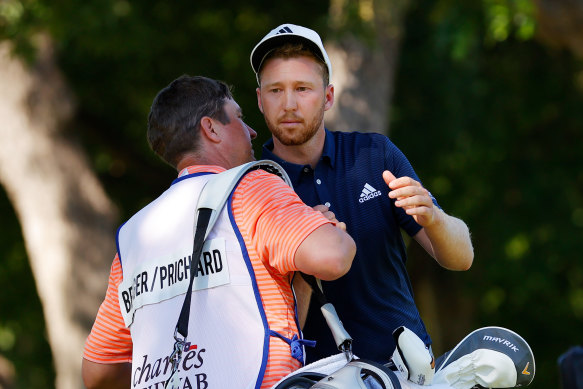 Daniel Berger celebrated with his caddie after winning the Charles Schwab Challenge.
