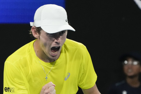 Australia’s Alex de Minaur reacts after winning a point against Spain’s Rafael Nadal.