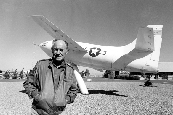 Chuck Yeager poses at Edwards Air Force Base, California, in 1985, in front of the rocket-powered Bell X-IE plane that he flew. 