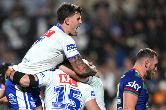 The Bulldogs celebrate a first-half try by Kurtis Morrin.