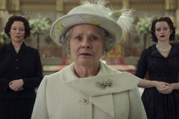 Queen Elizabeth II (Imelda Staunton) in the final episode of The Crown, flanked by her two earlier selves, played by Olivia Colman, left, and Claire Foy.