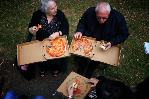 Patrons enjoy their pizza at the Italian Festa.