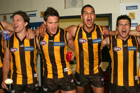 Hawthorn players celebrate their victory.