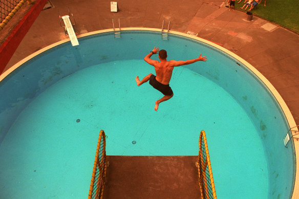 A swimmer jumps off the diving tower at the Harold Holt centre in 2003. 