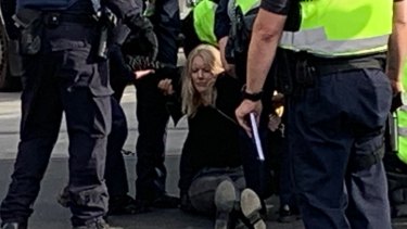 Protesters being moved by police about 9am. 