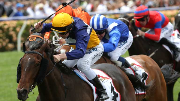 Aristia ridden by Damian Lane (yellow cap) wins race 2 the Mumm Wakeful Stakes during the AAMI Victoria Derby Day.