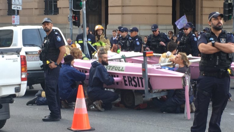 Climate Protesters Lock Themselves To Pink Vessel In Brisbane Cbd