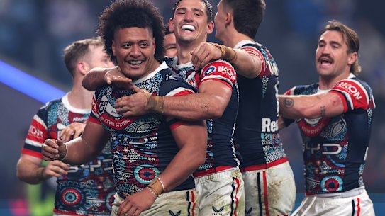 Naufahu Whyte celebrates his second for the Roosters.
