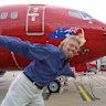Richard Branson promoting the airline in 2002. What name did Virgin Australia originally go by?
