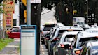 Cars queue for petrol in Sydney as some people panic-buy due to fears of shortages or price increases.