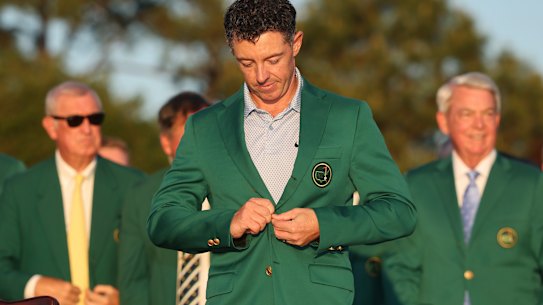 Rory McIlroy buttons up the green blazer presented to the US Masters champion – his second in two years.