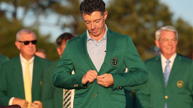 Rory McIlroy buttons up the green blazer presented to the US Masters champion – his second in two years.