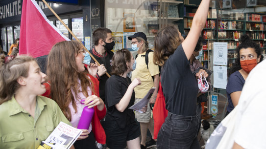 Protesters marching past the Better Read than Dead store in Newtown.