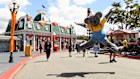 Dreamworld mascot Kenny the koala jumps for joy at the reopening of the Gold Coast theme park after COVID.