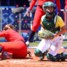 Australia’s softballers push US to extra innings but lose in heartbreaker