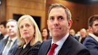 Finance Minister Katy Gallagher and Treasurer Jim Chalmers watch the PM speak on Wednesday.